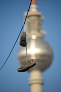 GERMANY Berlin shoes on a power line with a view of Alex. Germany Berlin Shoes are hanging over an