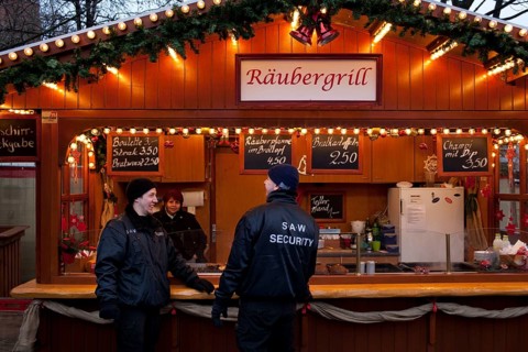 Berlin 2010-11-24 Security guards in front of the snack bar at a Christmas market. DEU Berlin