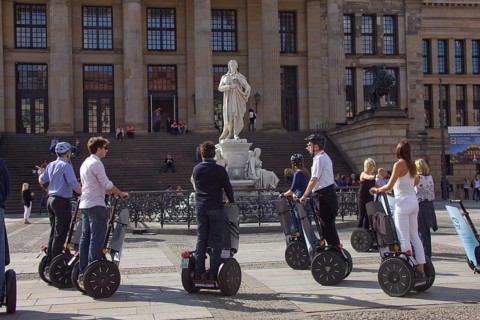 GERMANY Berlin Segway drivers during a guided city tour in front of the Schiller Monument on the