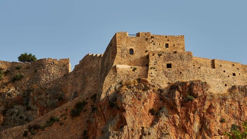 Stone fortress on rocky hill with reddish rock, Monemvasia, Monemvassia, Malvasy, small Byzantine
