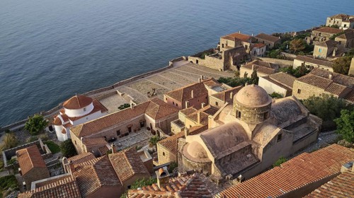 Drone shot, Holy Church of the Virgin Mary Chrysaphitissa, historic town with tiled roofs and