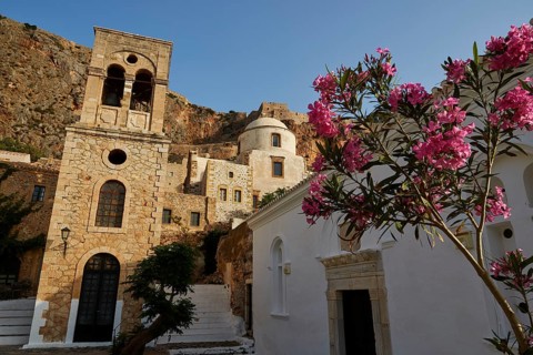 Holy Church of Christ in Chains, Elkomenos Christos, church and tower in front of a rock, with