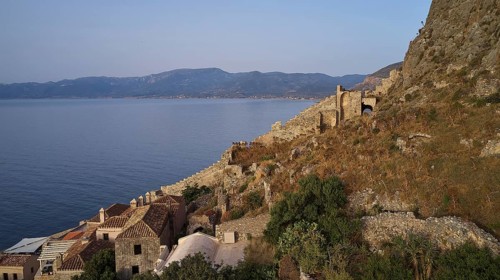Drone shot, coastal landscape with medieval ruins and view of the blue sea, Monemvasia,