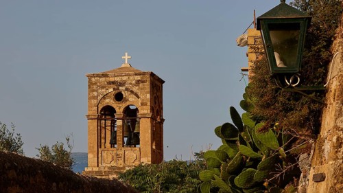 Soft morning light, Holy Church of Christ in Chains, Elkomenos Christos, bell tower with cross next