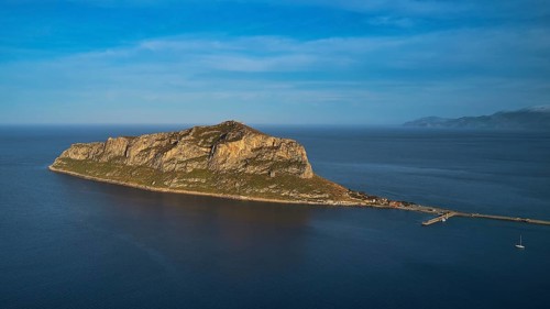 Drone shot, rocky island in calm sea under a blue sky, Monemvasia, Monemvassia, Malvasy, Byzantine