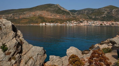 Quiet coastline with mountains in the background and a picturesque village, Monemvasia,