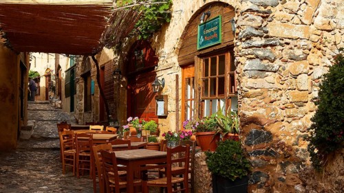 Picturesque restaurant with rustic charm and vibrant plants, Monemvassia, Malvasy, Byzantine small