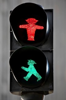 Pedestrian traffic light with red east traffic light man Stoppi and green east traffic light man