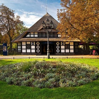 Entrance to Dahlem-Dorf subway station, thatched half-timbered house in the style of a North German