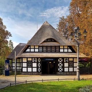 Entrance to Dahlem-Dorf subway station, thatched half-timbered house in the style of a North German