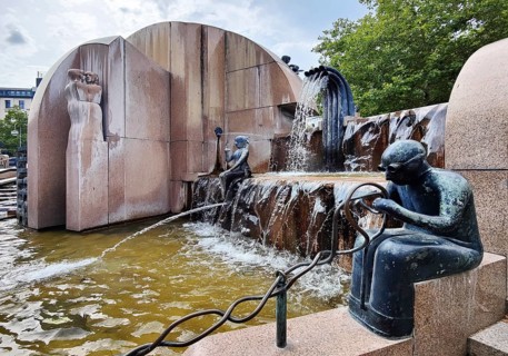 Weltkugelbrunnen with turner in the foreground, also known as Schmettau Fountain or Wasserklops, by