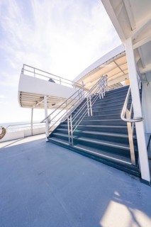 A steep staircase leads up to a deck, with a wide view of the sea, Schifffahrt, Lake Constance,