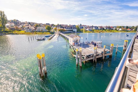 View from a ship of an open pier on the water, Schiff Fahrt, Lake Constance, Germany