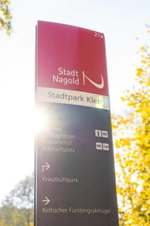 Signpost in Nagold City Park in autumn sunlight, Nagold, Black Forest, Germany