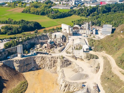 Detailed view of a quarry with diverse industrial plants and surrounding fields, Nagold, Black
