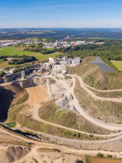An industrial complex in a quarry in a rural area with fields, Nagold, Black Forest, Germany