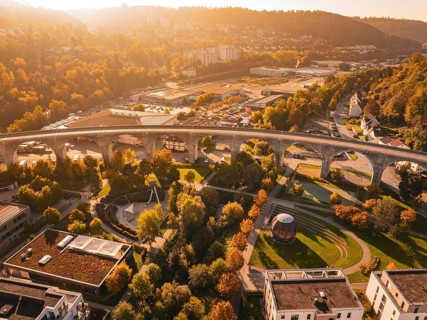 A viaduct in an autumn urban landscape, surrounded by buildings and parks, Nagold, Black Forest,