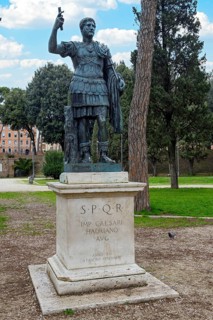 Statue of Emperor Hadrian on pedestal with inscription IMP for Emperor CAESARI HADRIANO AVG