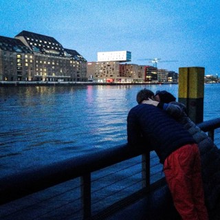 DEU Germany Germany Berlin A couple on the banks of Watergate, a club on the Oberbaum Bridge