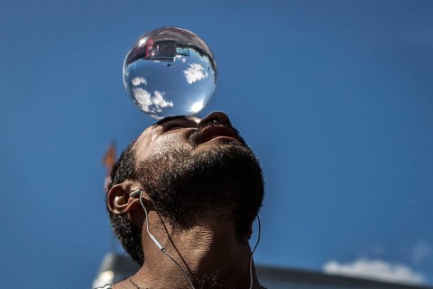 DEU Germany Germany Berlin Juggler with crystal ball works at the intersection opposite the CDU