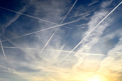 Airplanes with contrails in the sky in Hamburg, Germany