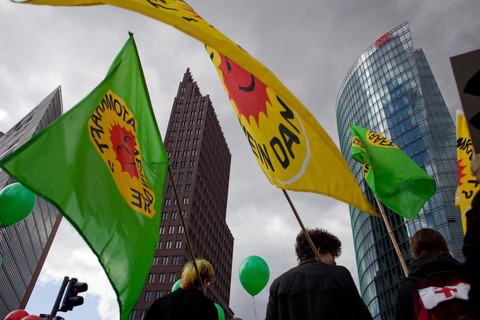 Germany Berlin Anti-nuclear power demonstration in Berlin Mitte. Demonstrators with flags in front