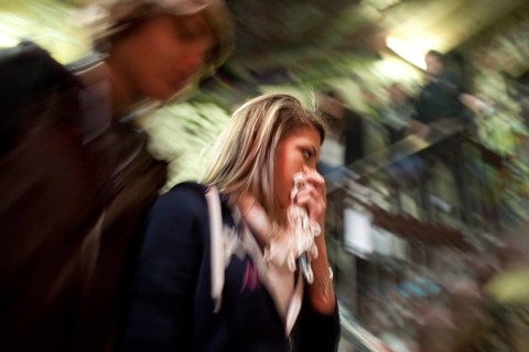 DEU Berlin visitors to Tacheles. Woman protects herself from urine stench Germany Berlin Visitors