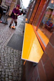 DEU Germany Berlin Orange Bank in front of a shop on a street in Berlin Mitte. Germany Berlin