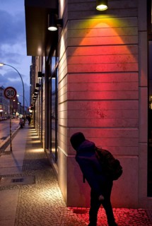 DEU Germany Berlin A boy looks around the corner at Rosenthaler Straße in Berlin Mitte. Germany