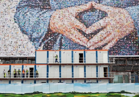 DEU Germany Germany Berlin large poster with Angela Merkel's hands on a building near the main