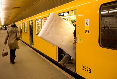DEU Germany Berlin traveler with mattress boards the U 9 towards Osloer Straße in the