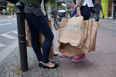 DEU Germany Germany Berlin Young girl with opened Primark shopping bag on Kurfürstendamm in Berlin
