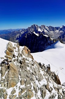 View from the Aiguille du Midi mountain station observation deck of the mountains Aiguille Vert,