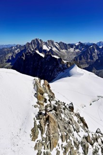 View from the Aiguille du Midi mountain station observation deck of the mountains Aiguille Vert,