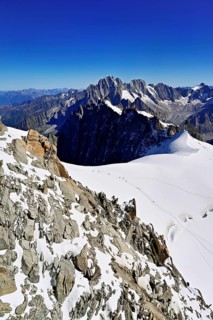 View from the Aiguille du Midi mountain station observation deck of the mountains Aiguille Vert,