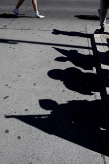 DEU Germany Germany Berlin tourists at Checkpoint Charlie. Shadows of extras disguised as soldiers