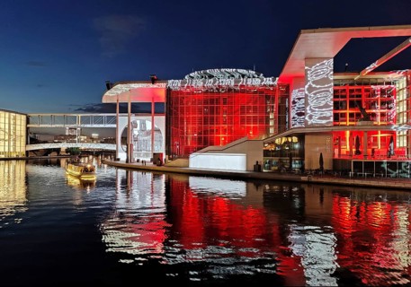 Illuminated Paul Löbe House and Marie Elisabeth Lüders House with the Spree River in the evening,