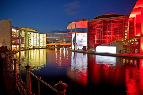 Illuminated Paul Löbe House and Marie Elisabeth Lüders House with the Spree River in the evening,