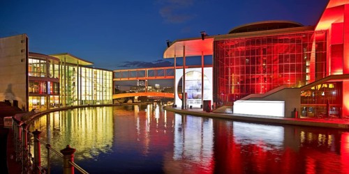 Illuminated Paul Löbe House and Marie Elisabeth Lüders House with the Spree River in the evening,