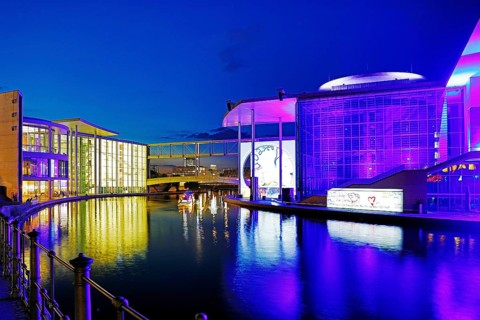 Illuminated Paul Löbe House and Marie Elisabeth Lüders House with the Spree River in the evening,