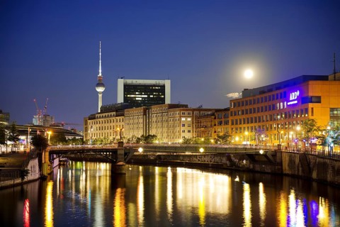 The river Spree in the government district with a full moon, the ARD capital studio and the Berlin