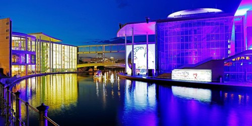 Illuminated Paul Löbe House and Marie Elisabeth Lüders House with the Spree River in the evening,