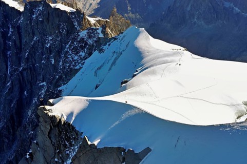 Snow-covered mountain ridge, Aiguille du Midi mountain station viewing platform,