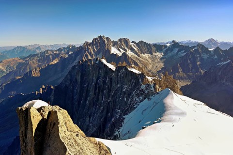 View from the Aiguille du Midi mountain station observation deck of the mountains Aiguille Vert,