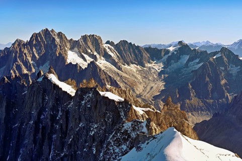 View from the Aiguille du Midi mountain station observation deck of the mountains Aiguille Vert,