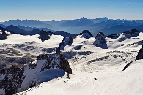 View of the snow-capped mountains from the Aiguille du Midi mountain station observation deck,