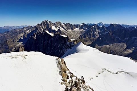 View from the Aiguille du Midi mountain station observation deck of the mountains Aiguille Vert,