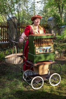 DEU Germany Germany Berlin An organ box woman plays for wedding guests during a reception in the