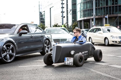 DEU Germany Germany Berlin A mini hot rod driver in traffic at Potsdamer Platz