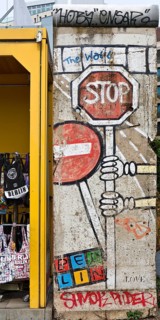 Old telephone box and painted piece of the Berlin Wall, gift shop Berlin loves you, Zimmerstraße,